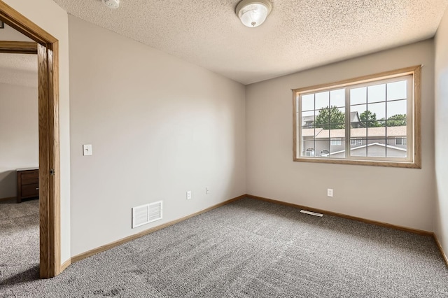 1127 Ridgestone Pl, Buffalo, MN 55313 - unfurnished room with carpet flooring, a textured ceiling, and a smoke detector