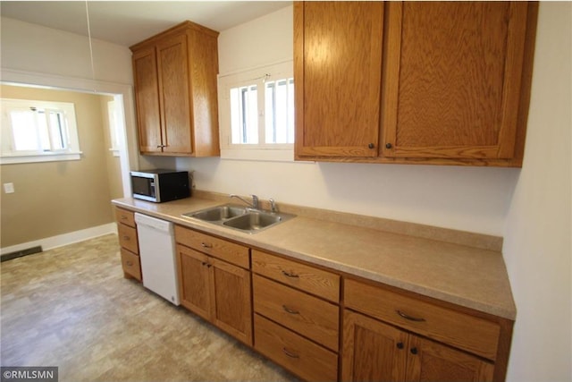 132 4th Ave N, Waite Park, MN 56387 - kitchen featuring stainless steel microwave, dishwasher, a sink, and healthy amount of natural light