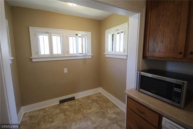 132 4th Ave N, Waite Park, MN 56387 - laundry room with baseboards