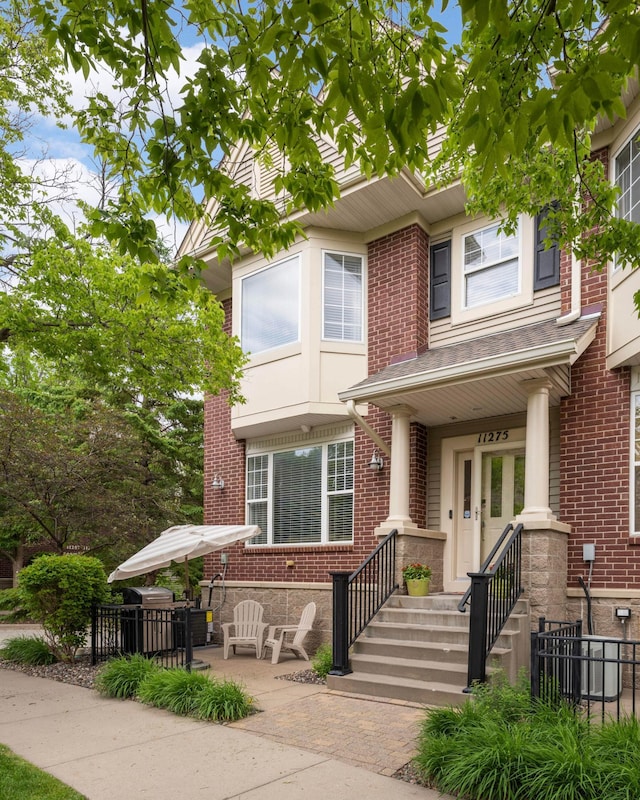 11275 Preswick Blvd, Eden Prairie, MN 55344 - townhome / multi-family property featuring brick siding