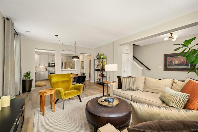 11275 Preswick Blvd, Eden Prairie, MN 55344 - living area featuring light wood-type flooring and stairs