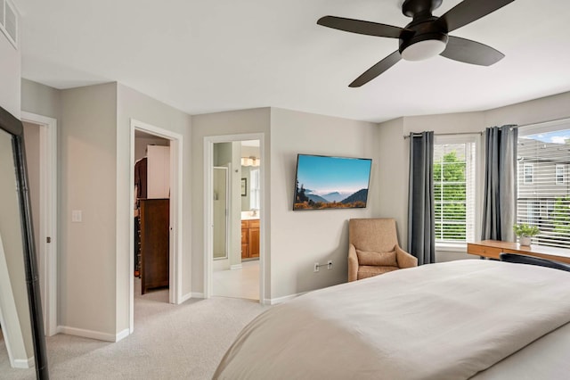 11275 Preswick Blvd, Eden Prairie, MN 55344 - bedroom with light carpet, baseboards, ensuite bath, and a ceiling fan