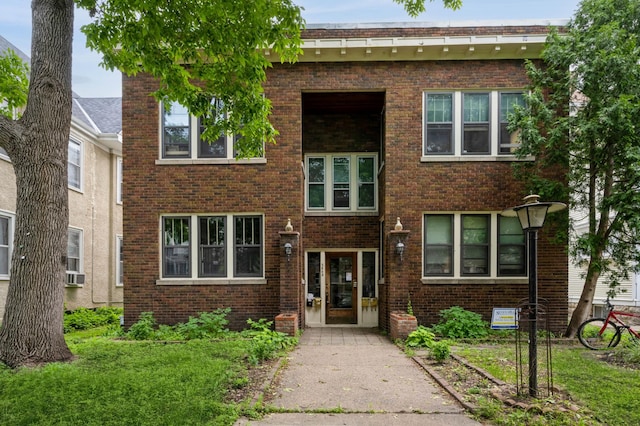 2545 Bryant Ave S Unit 1, Minneapolis, MN 55405 - view of front facade featuring brick siding and cooling unit