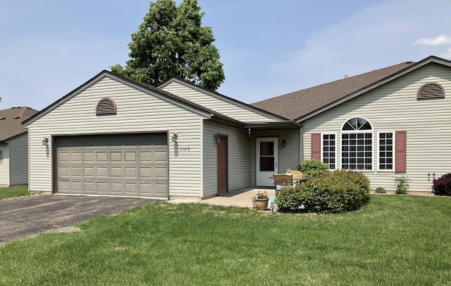 1332D Carriage Dr, Hudson, WI 54016 - single story home featuring driveway, a garage, a front yard, and a shingled roof