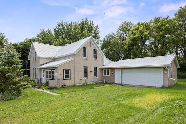 35746 585th Ave, Lafayette, MN 56054 - view of front of property with a front lawn, a metal roof, stucco siding, and an attached garage