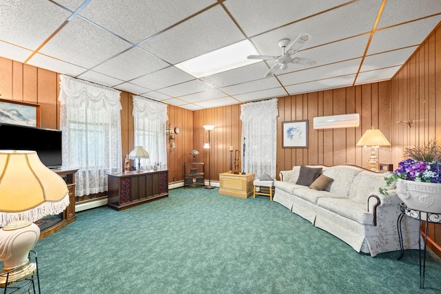 35746 585th Ave, Lafayette, MN 56054 - carpeted living room featuring baseboard heating, a paneled ceiling, wooden walls, a baseboard radiator, and a wall mounted AC
