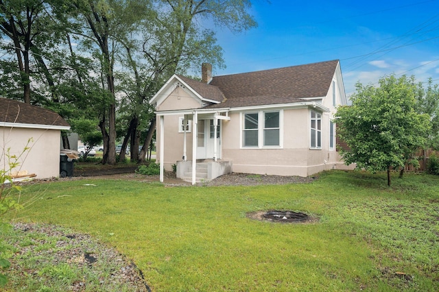 414 Western Ln, Anoka, MN 55303 - view of front of property featuring a shingled roof, stucco siding, and a chimney