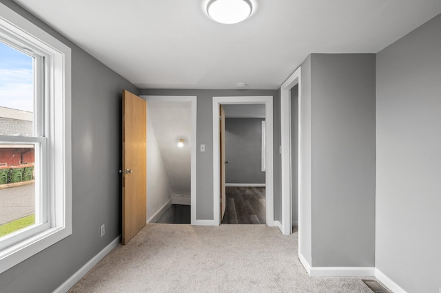 414 Western Ln, Anoka, MN 55303 - unfurnished bedroom featuring carpet flooring and baseboards
