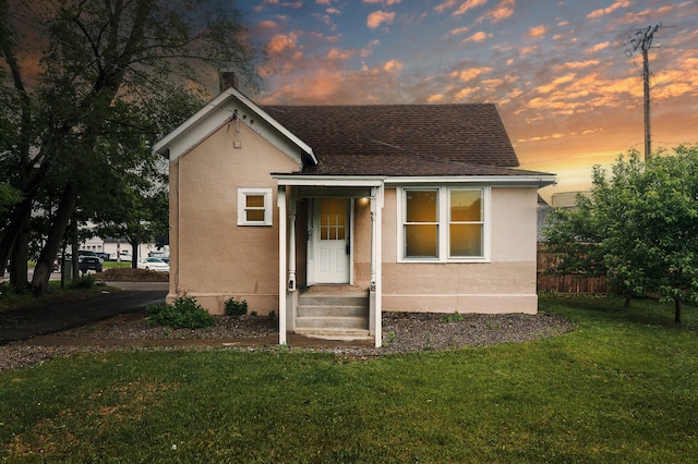 414 Western Ln, Anoka, MN 55303 - bungalow-style home featuring stucco siding and roof with shingles