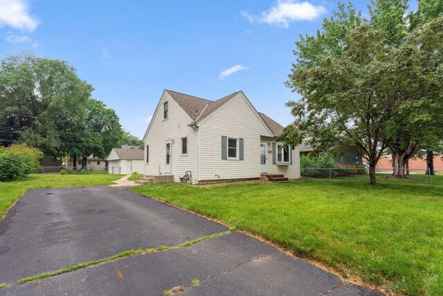 225 7th Ave NE, Osseo, MN 55369 - view of property exterior featuring entry steps and asphalt driveway