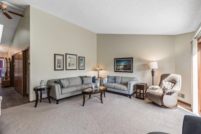 7582 Ojibway Park Bay, Woodbury, MN 55125 - living area with carpet flooring, a ceiling fan, a textured ceiling, and high vaulted ceiling