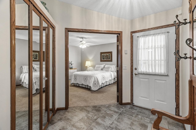 7582 Ojibway Park Bay, Woodbury, MN 55125 - bedroom featuring light colored carpet, a textured ceiling, and a closet