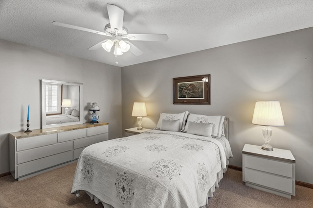 7582 Ojibway Park Bay, Woodbury, MN 55125 - bedroom featuring carpet floors, a textured ceiling, and a ceiling fan
