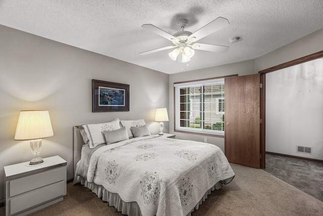 7582 Ojibway Park Bay, Woodbury, MN 55125 - carpeted bedroom featuring a textured ceiling and ceiling fan