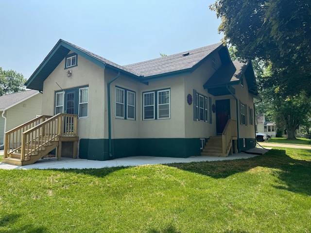 1315 Clark St W, Albert Lea, MN 56007 - view of side of property with a yard and stucco siding