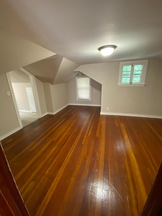1315 Clark St W, Albert Lea, MN 56007 - additional living space with hardwood / wood-style floors, vaulted ceiling, and baseboards