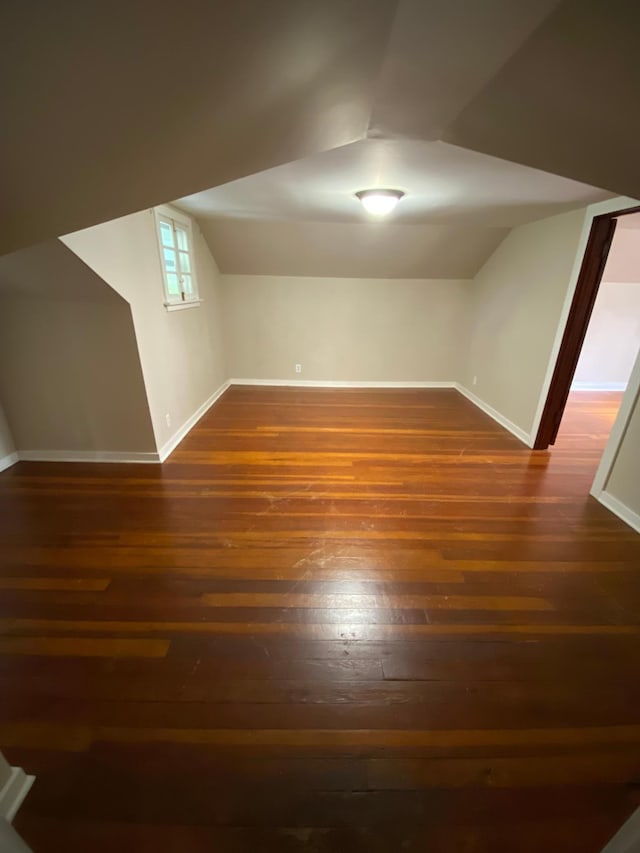 1315 Clark St W, Albert Lea, MN 56007 - additional living space featuring baseboards, dark wood finished floors, and vaulted ceiling