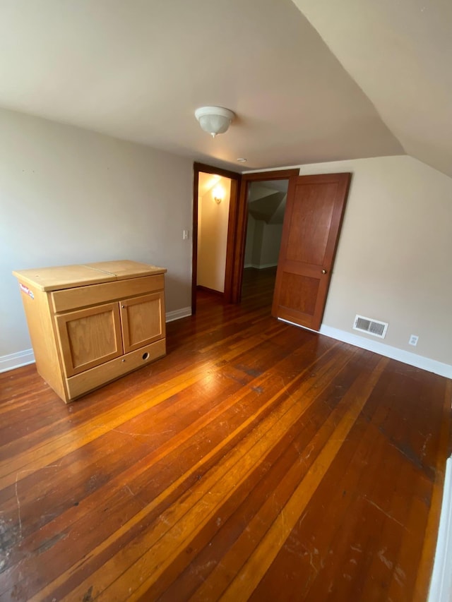 1315 Clark St W, Albert Lea, MN 56007 - unfurnished room featuring dark wood-type flooring and vaulted ceiling