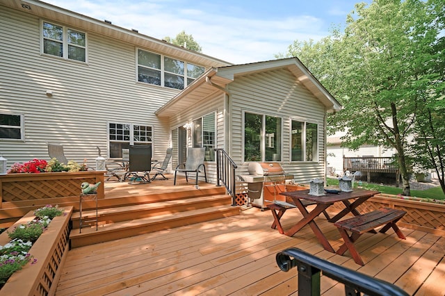 10426 Hidden Oaks Ln N, Champlin, MN 55316 - wooden terrace with outdoor dining area and grilling area
