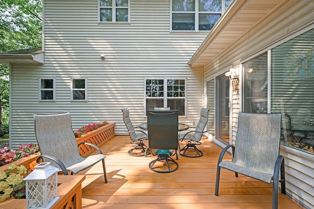 10426 Hidden Oaks Ln N, Champlin, MN 55316 - wooden deck with outdoor dining area