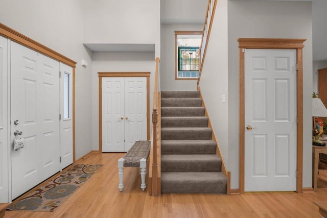 10426 Hidden Oaks Ln N, Champlin, MN 55316 - entryway featuring stairway and light wood-style flooring