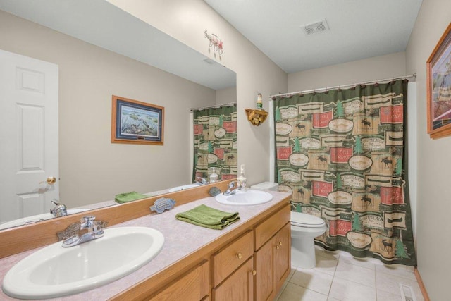 10426 Hidden Oaks Ln N, Champlin, MN 55316 - full bathroom featuring double vanity, tile patterned floors, and curtained shower