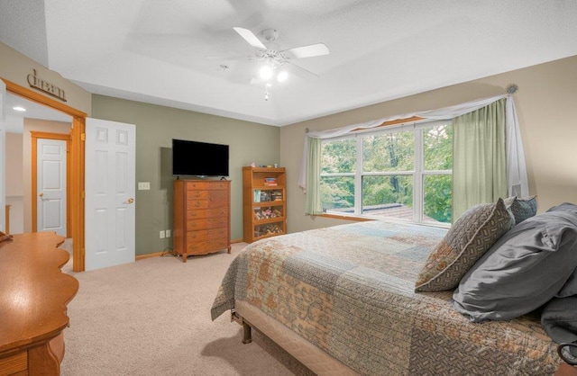 10426 Hidden Oaks Ln N, Champlin, MN 55316 - carpeted bedroom featuring a ceiling fan and a tray ceiling