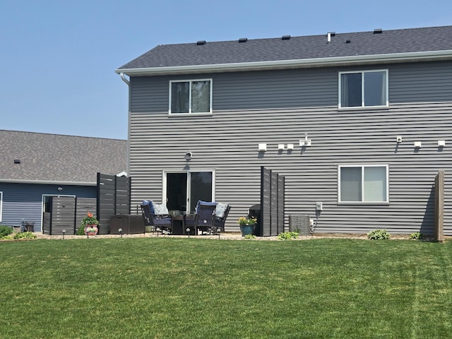 924 3rd Ave SE, Hayfield, MN 55940 - rear view of house with a yard and a patio area