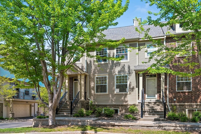 8280 Labont Way, Eden Prairie, MN 55344 - multi unit property featuring entry steps, a garage, driveway, and a chimney