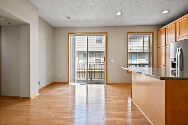 8280 Labont Way, Eden Prairie, MN 55344 - kitchen featuring stainless steel fridge with ice dispenser, light wood-style floors, a textured ceiling, recessed lighting, and baseboards