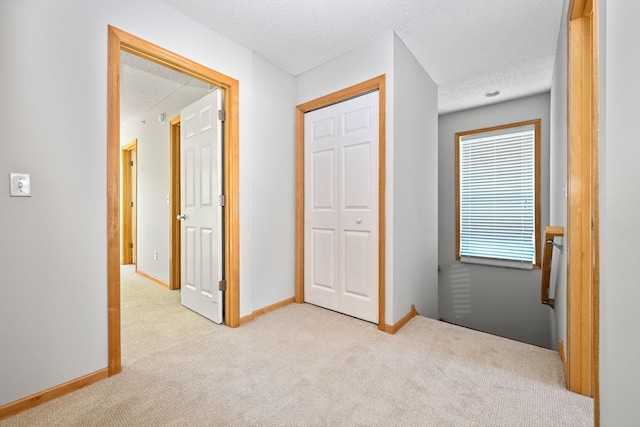 8280 Labont Way, Eden Prairie, MN 55344 - corridor with carpet flooring, a textured ceiling, and baseboards