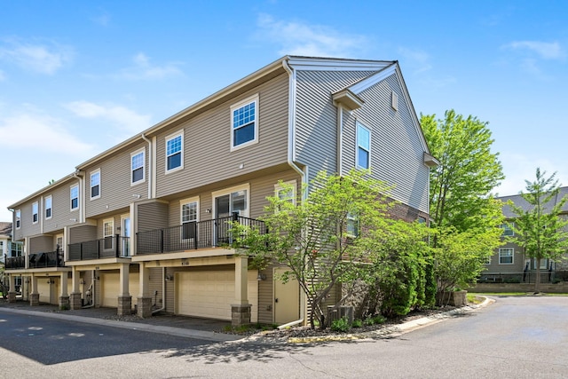 8280 Labont Way, Eden Prairie, MN 55344 - view of building exterior with a garage and a residential view