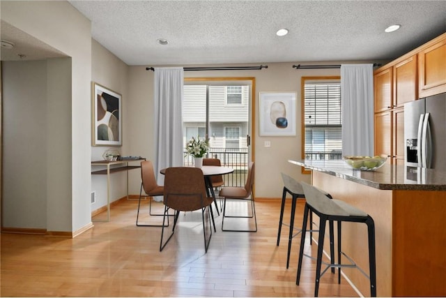 8280 Labont Way, Eden Prairie, MN 55344 - dining room featuring a textured ceiling, light wood-type flooring, baseboards, and recessed lighting