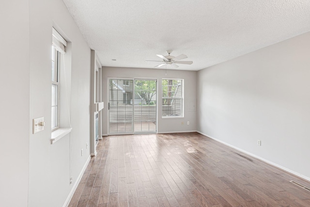 2040 Shenandoah Ct Unit B, Plymouth, MN 55447 - spare room featuring ceiling fan, wood finished floors, and a textured ceiling