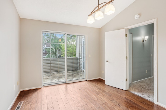 2040 Shenandoah Ct Unit B, Plymouth, MN 55447 - spare room with a smoke detector, wood finished floors, and lofted ceiling