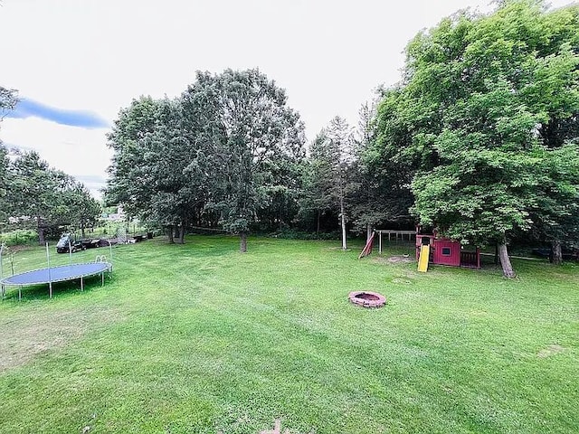 2120 Walden Blvd NW, Oak Grove, MN 55011 - view of green lawn with a trampoline