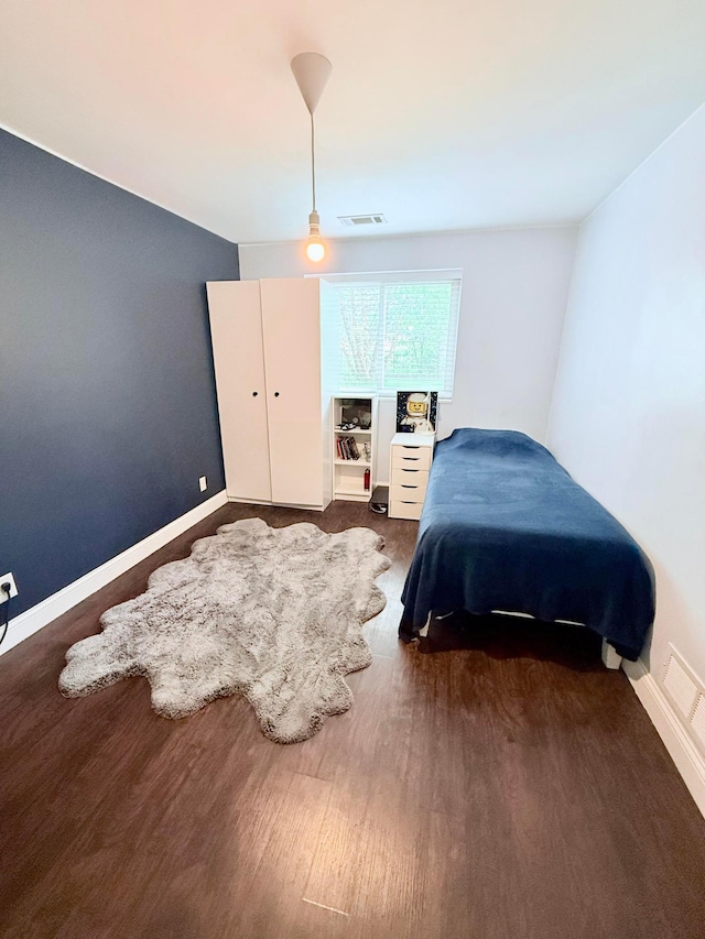 2120 Walden Blvd NW, Oak Grove, MN 55011 - bedroom with baseboards and wood finished floors