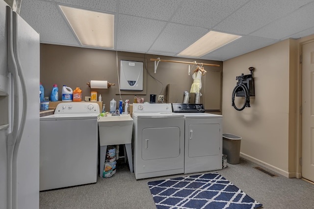 14789 Fireside Cir, Cold Spring, MN 56320 - laundry room featuring separate washer and dryer and carpet
