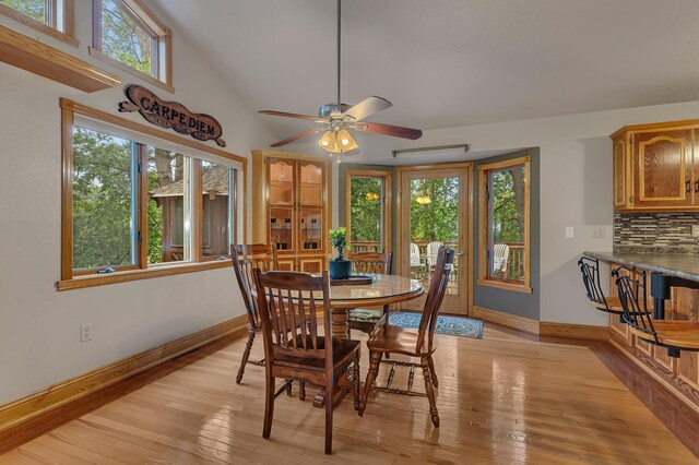 14789 Fireside Cir, Cold Spring, MN 56320 - dining room with healthy amount of natural light, light wood-type flooring, ceiling fan, and vaulted ceiling