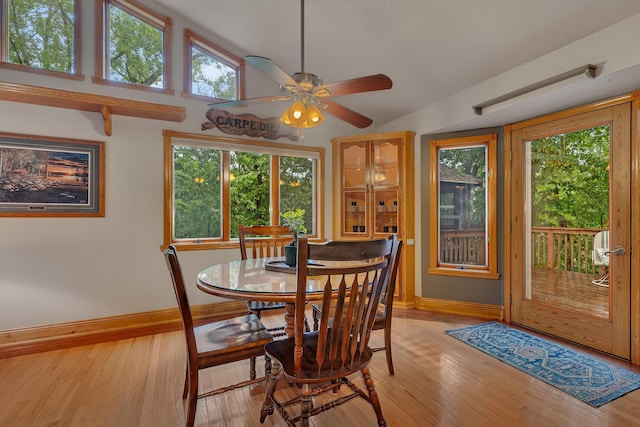 14789 Fireside Cir, Cold Spring, MN 56320 - dining area featuring light wood-type flooring, vaulted ceiling, and a ceiling fan