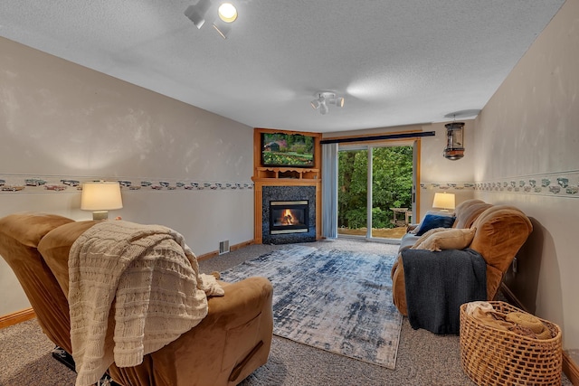 14789 Fireside Cir, Cold Spring, MN 56320 - carpeted living room featuring a textured ceiling and a tile fireplace