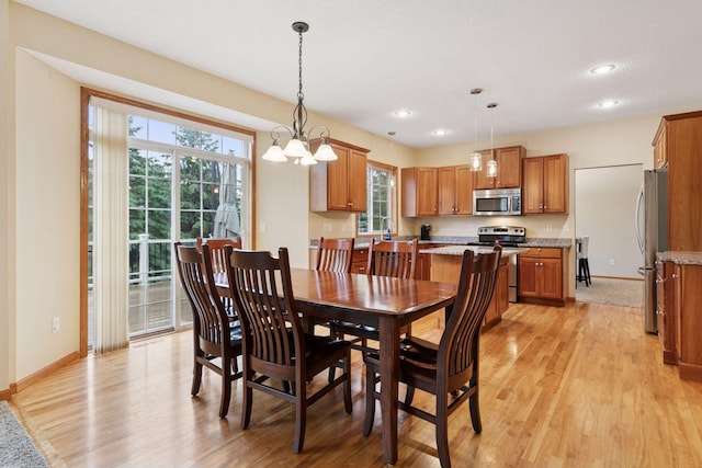 2097 138th St W, Rosemount, MN 55068 - dining space with healthy amount of natural light, light wood finished floors, recessed lighting, and a chandelier