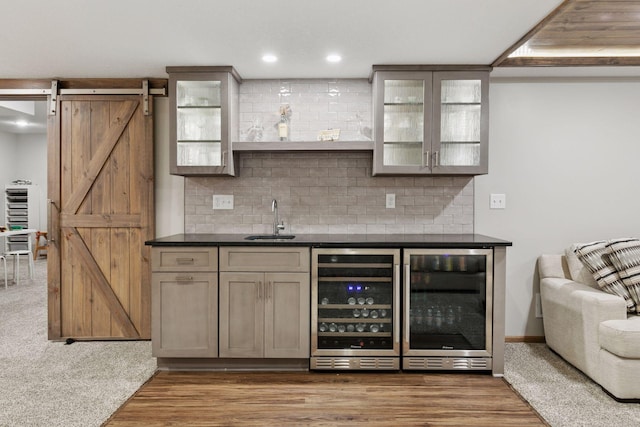 2097 138th St W, Rosemount, MN 55068 - indoor wet bar featuring beverage cooler, a barn door, tasteful backsplash, and recessed lighting