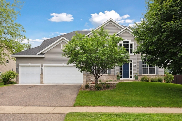 2097 138th St W, Rosemount, MN 55068 - view of front of property featuring asphalt driveway, a front lawn, a garage, and a shingled roof