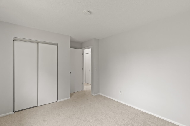 6716 83rd Ave N, Brooklyn Park, MN 55445 - unfurnished bedroom featuring light carpet and a closet
