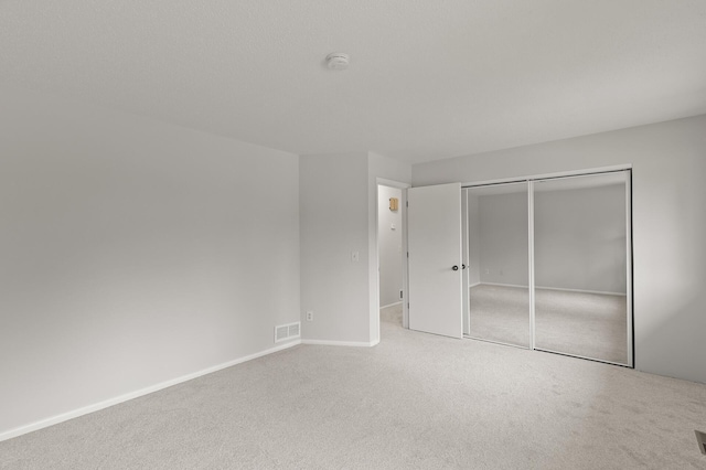 6716 83rd Ave N, Brooklyn Park, MN 55445 - unfurnished bedroom featuring carpet flooring and a closet