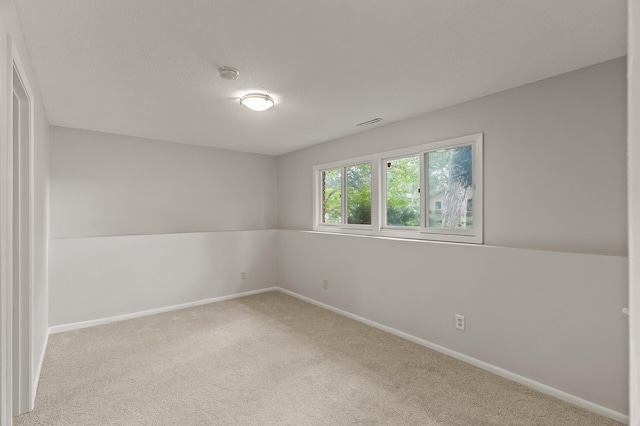 6716 83rd Ave N, Brooklyn Park, MN 55445 - carpeted empty room featuring a smoke detector and baseboards