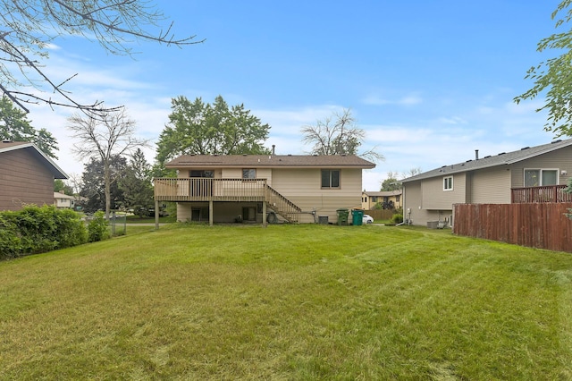 6716 83rd Ave N, Brooklyn Park, MN 55445 - back of house with stairway and a wooden deck