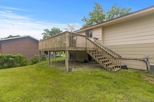 6716 83rd Ave N, Brooklyn Park, MN 55445 - rear view of property featuring a wooden deck, a yard, stairs, and a carport