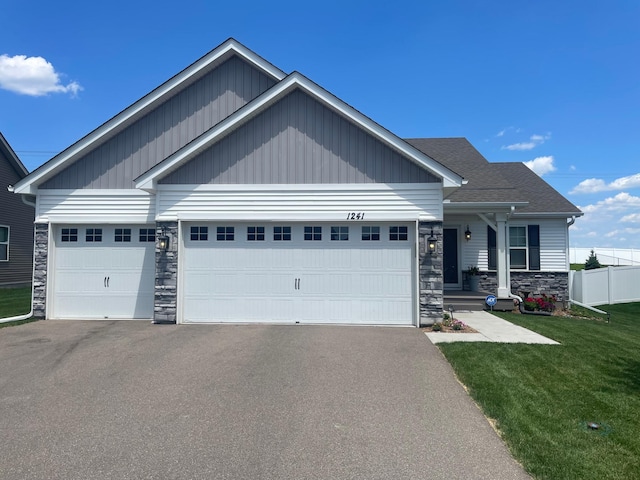 1241 136th St W, Rosemount, MN 55068 - craftsman house with stone siding, asphalt driveway, and a garage